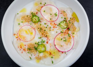 Carpaccio di capasanta all’olio di vaniglia e spezie